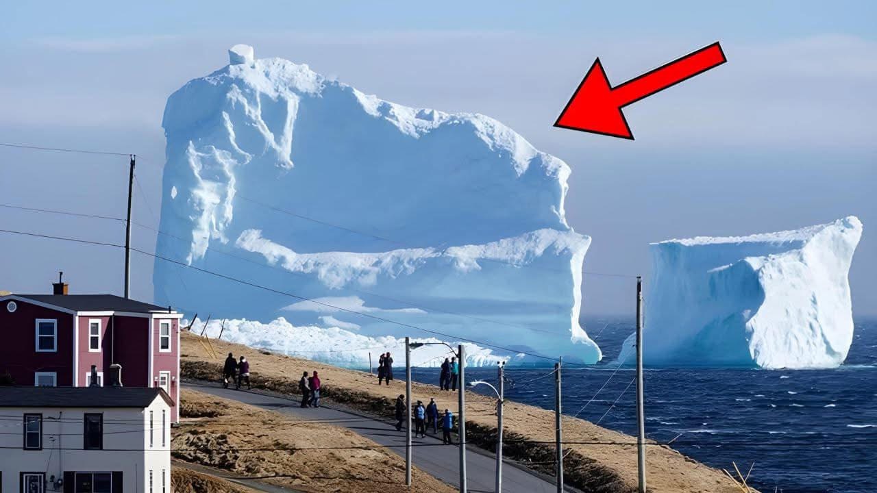 An iceberg drifts close to the nearby village. People Get Scared When They See What’s On It